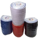 Four rolls of pure cotton bias tape in white, royal blue, red, and black, on a white background for sewing and tailoring supplies.