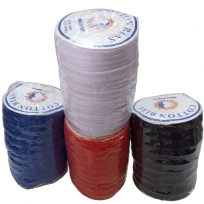 Four rolls of pure cotton bias tape in white, royal blue, red, and black, on a white background for sewing and tailoring supplies.